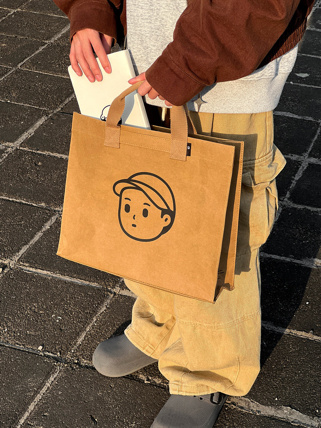 Kraft Paper Boy Tote in Medium – on-body shot 01