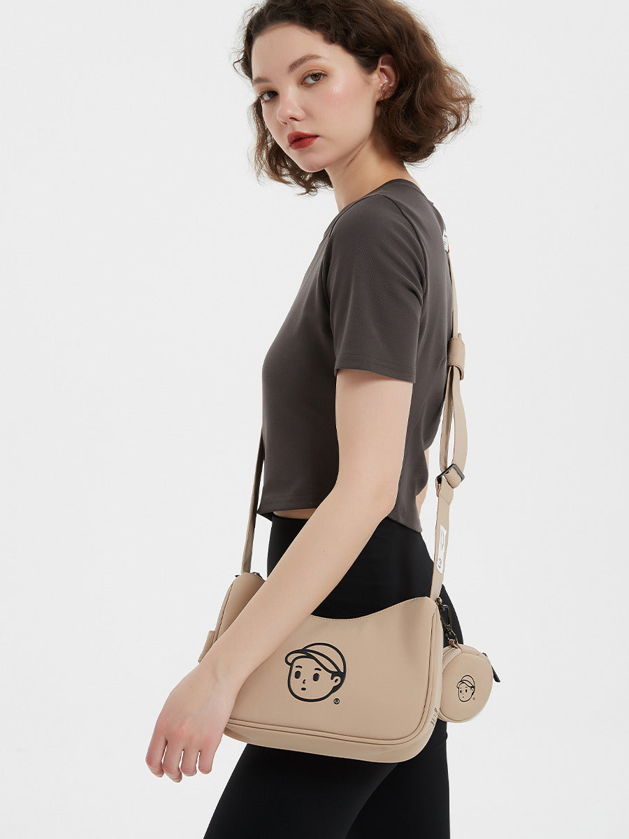 Nylon Shoulder Bag in Rock Sand – on-body shot 02