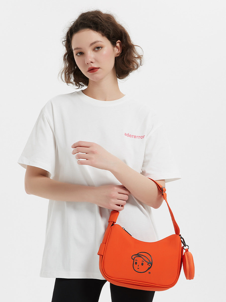 Nylon Shoulder Bag in Soft Orange – on-body shot 01