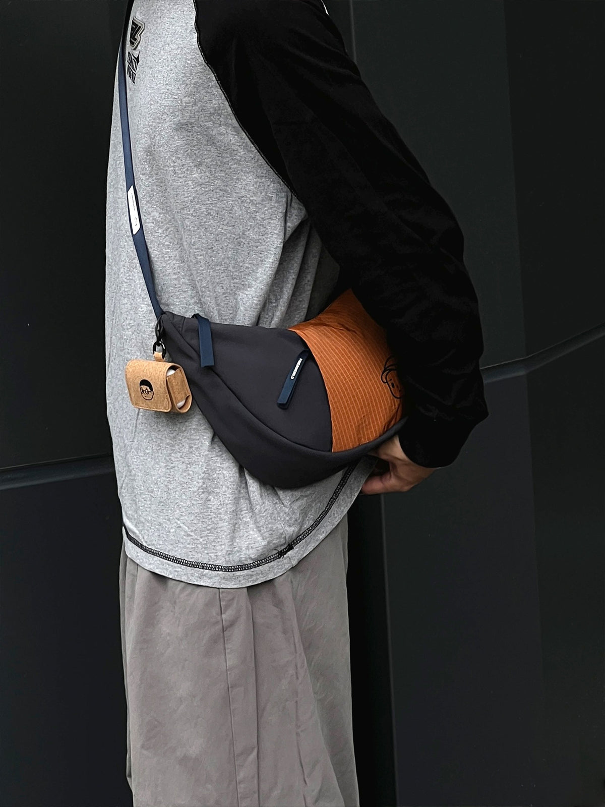 Patchwork Dumpling Bag in Navy – on-body shot 01