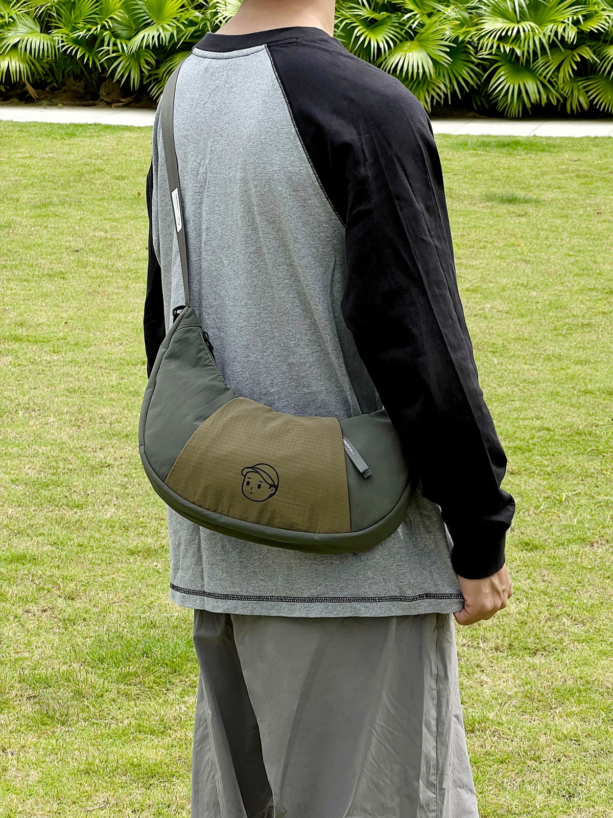 Patchwork Dumpling Bag in Olive – on-body shot 01