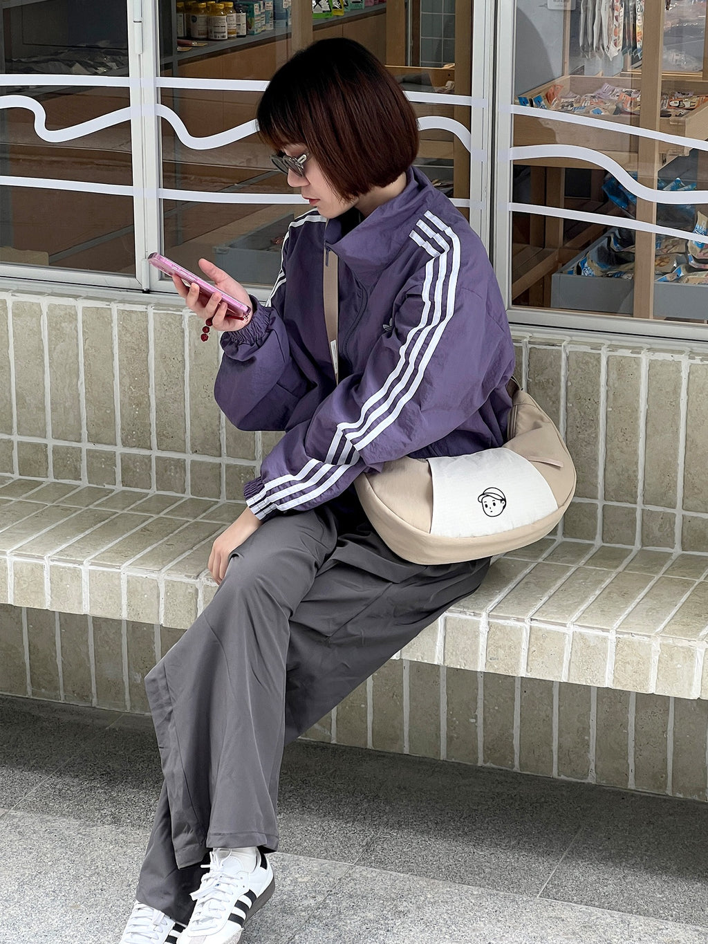Patchwork Dumpling Bag in Rock Sand – on-body shot 01