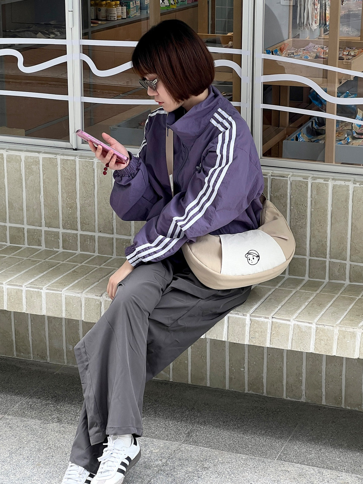 Patchwork Dumpling Bag in Rock Sand – on-body shot 01