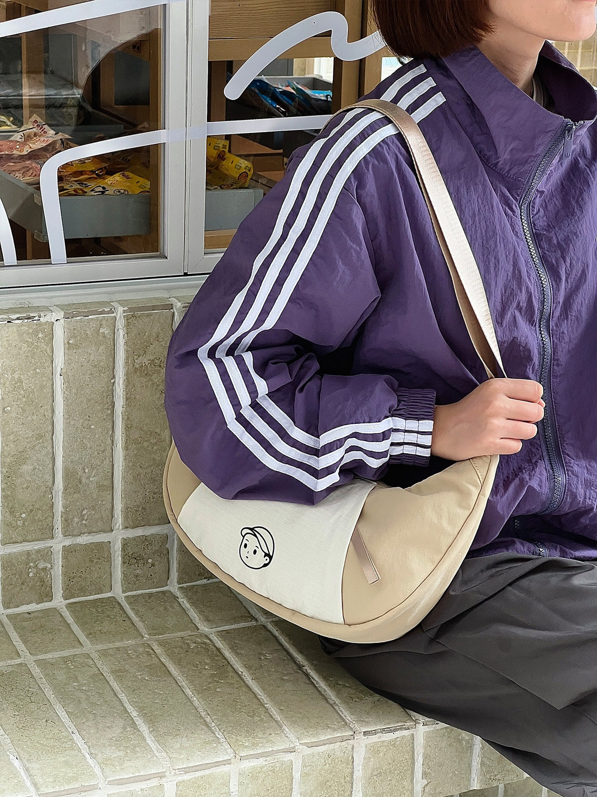 Patchwork Dumpling Bag in Rock Sand – on-body shot 02