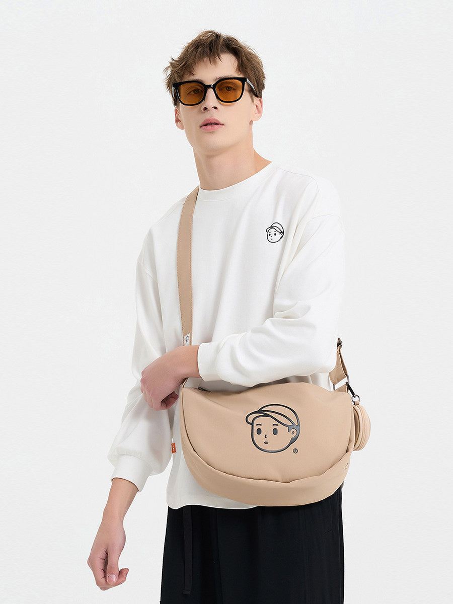 FINERWORLD Crescent Dumpling Crossbody Bag in Rock Sand - on-body shot